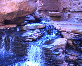 Rocks and waterfall and wetlands. Image by Information for Action, a website for conservation and environmental issues offering solutions