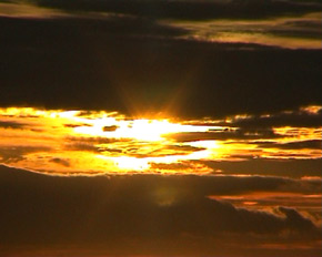 Sunset through clouds and wetlands. Image by Information for Action, a website for conservation and environmental issues offering solutions